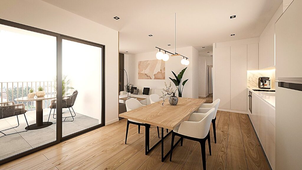 Salón comedor con cocina abierta y salida a la terraza en una vivienda de El Mirador de Santanyí